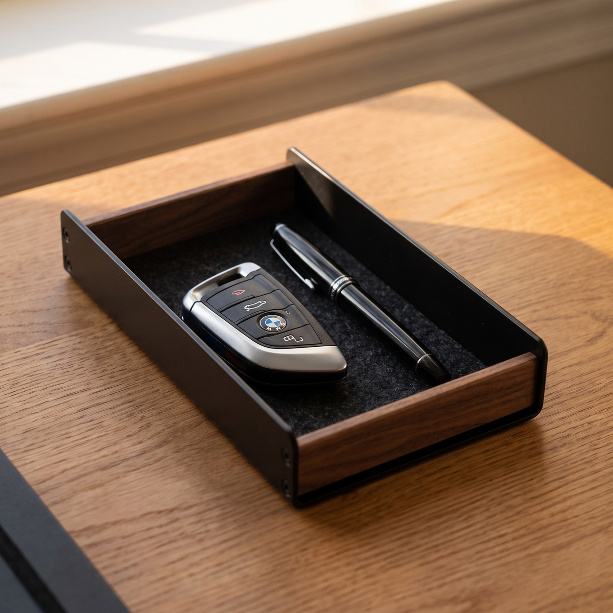 Aldermere pen tray holding a key fob and pens on an oak desk